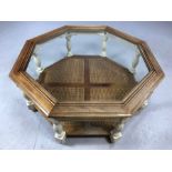 Octagonal wooden framed, glass topped coffee table with rattan lower shelf, approx 96cm x 96cm x