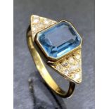 18ct Antique Gold ring set with a faceted Aquamarine and eight diamonds set to large triangular