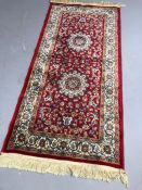 Small red ground Kashmir rug / runnner, approx 145cm x 67cm