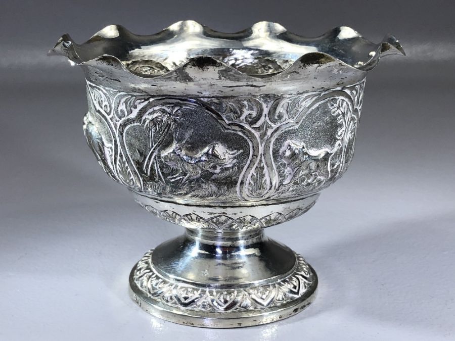 Indian silver bowl marked V.75 and with Repousse decoration depicting Boars, Elephants, Lions etc