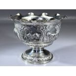 Indian silver bowl marked V.75 and with Repousse decoration depicting Boars, Elephants, Lions etc