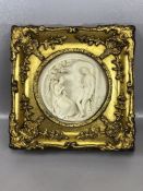 Gilt framed alabaster plaque depicting a man and woman, approx 29cm x 29cm