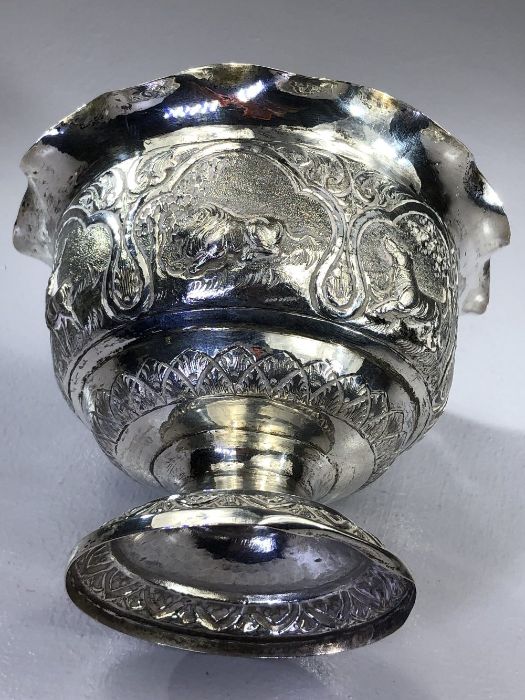 Indian silver bowl marked V.75 and with Repousse decoration depicting Boars, Elephants, Lions etc - Image 5 of 6