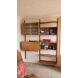 DANISH ROYAL MODULAR SYSTEM: A wall mounted Mid Century modular shelving and storage unit system (