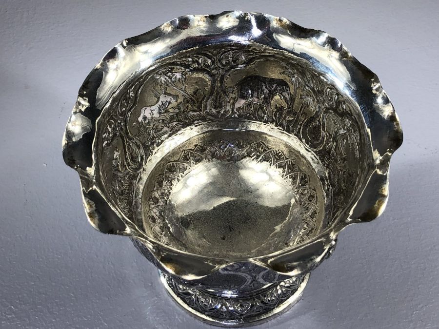 Indian silver bowl marked V.75 and with Repousse decoration depicting Boars, Elephants, Lions etc - Image 4 of 6