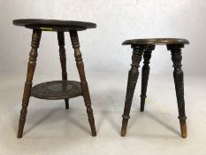 Two heavily carved oak tripod tables, the tallest approx 53cm in height