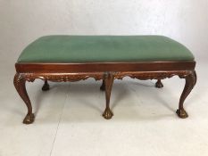 Green upholstered double stool with carved detailing, approx 122cm x 55cm x 55cm tall (A/F)