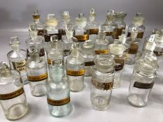 Collection of 19th Century clear glass chemist apothecary bottles with stoppers, various gilt