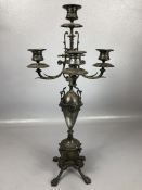 Neo-classical Silver coloured metal candelabra on clawed feet with central ovoid section with