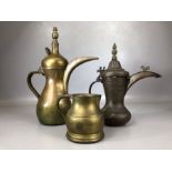 Collection of Middle Eastern metalware to include brass and copper tea / coffee pots and jug