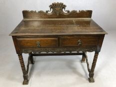 Antique oak writing desk on bobbin turned legs and splayed front feet with two drawers under and