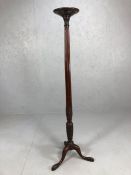 Large Victorian mahogany plant stand with reeded design, carved detailing and standing on tripod