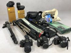 Collection of camera equipment to include Nikon Coolpix, Olympus OM-D, and Panasonic Lumix
