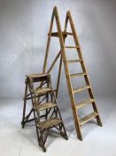 Two sets of vintage folding ladders, the larger approx 188cm in height, the smaller approx 86cm in