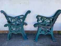 Two pairs of green wrought iron bench ends, each approx 77cm in height at back
