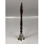 Silver candle snuffer on a turned wooden handle approx 21cm long Hallmarked for London maker W H &