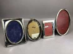 Good collection of four Silver coloured photo frames some continental silver