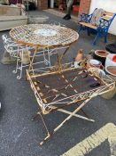 Two metal garden plant stands and a metal garden table
