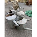 Collection of four vintage watering cans