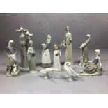 Collection of ten Lladro figurines to include pair of nuns, girl with lamb, two geese etc, the