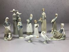 Collection of ten Lladro figurines to include pair of nuns, girl with lamb, two geese etc, the