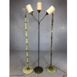 Three mid century standard lamps. Two in metal and agate and one to include a trio of adjustable