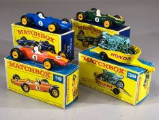 Four boxed Matchbox Series diecast model vehicles: 19 Green, 19 Orange, 38 Honda Motorcycle with