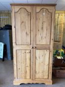 Pine two door wardrobe, with drawer below, approx 107cm x 62cm x 217cm tall