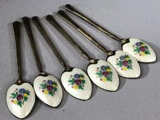 Set of six Silver hallmarked spoons each with colourful enamel backs with flowers on a white ground.