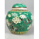 19th/ 20thC Chinese porcelain green enamelled ginger jar and cover, decorated with birds and blossom