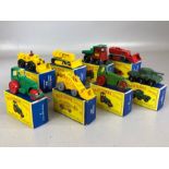 Eight boxed Matchbox Series diecast model vehicles: 18 Caterpillar Bulldozer, 2 Muir-Hill Dumper,