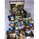 Large collection of vintage postcards in a number of albums, in a vintage suitcase