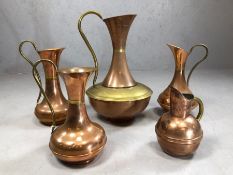 Collection of five brass and copper jugs, the tallest approx 43cm in height
