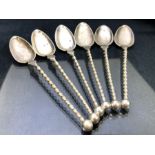 Set of six continental twisted long handled spoons each marked 830 and makers mark 'GH' total weight