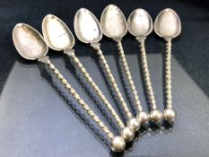 Set of six continental twisted long handled spoons each marked 830 and makers mark 'GH' total weight