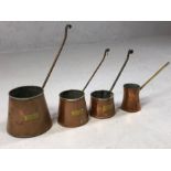 Collection of four antique copper spirit measures