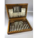 A boxed set of Mappin & Webb fruit knives and forks twelve place settings