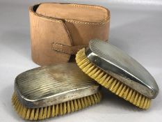 Pair of hallmarked silver clothes brushes with engine turned decoration hallmarked for London by