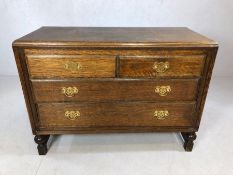 Solid wood chest of four drawers with brass handles, approx 106cm x 46cm x 78cm tall