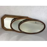 Collection of three wooden framed mirrors, two oval, all bevel-edged, the largest approx 83cm in