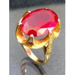 9ct Gold ring set with a large faceted red stone approx 17.7 x 12.2mm (stone tests on electronic