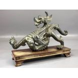Cast metal Chinese figure of a dragon on wooden base, approx 23cm in length