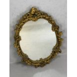 Oval gilt framed mirror, approx 65cm x 47cm