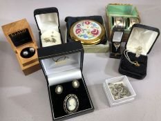 Good collection of costume jewellery to include earrings, a garnet ring, necklaces etc