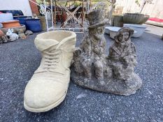 Concrete boot planter and a garden statue
