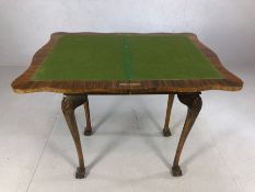 Metamorphic games table on ball and claw feet with baize top. When fully extended approx 90cm x 68cm