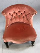 Antique pink upholstered bedroom chair on castors