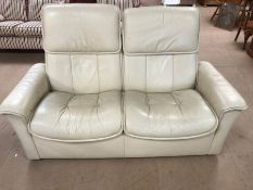 Two seater cream leather reclining sofa, approx 160cm in length