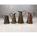 Collection of four antique hammered and snakeskin design copper jugs, the tallest approx 28cm in