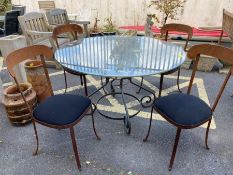 Wrought iron garden table with circular glass top, approx 125cm in diameter, and four contemporary